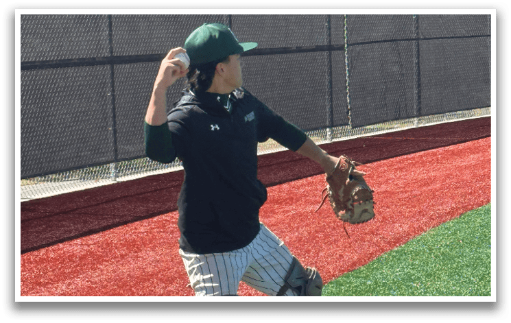A baseball player wearing a green and white uniform with the number 10 on the back. Description generated by AI