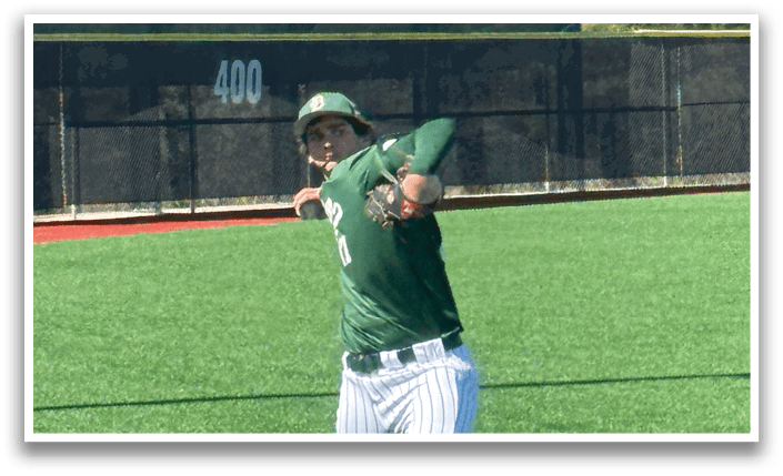 A baseball player is swinging a bat on a field. Description generated by AI