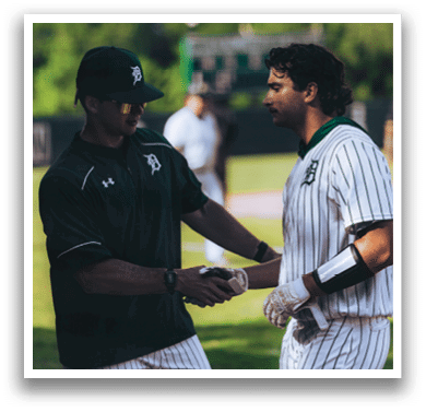 A baseball player is standing on the field. Description generated by AI