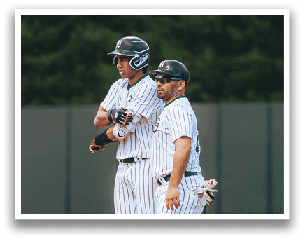 A baseball player is sliding into home plate. Description generated by AI