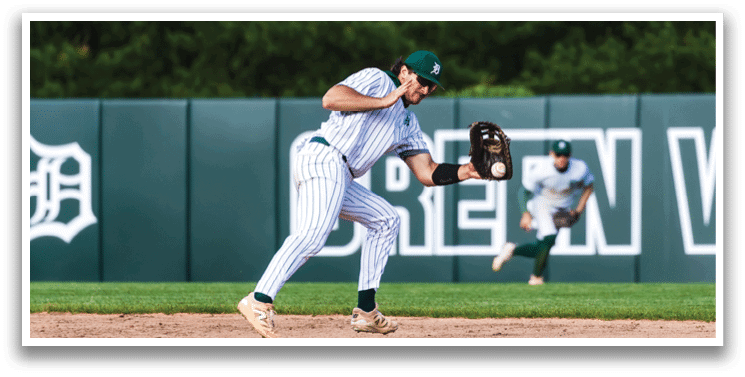 A baseball player is at bat, holding a bat and waiting for the pitch. Description generated by AI