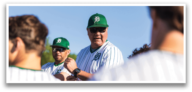 A baseball player is swinging a bat at a ball. Description generated by AI