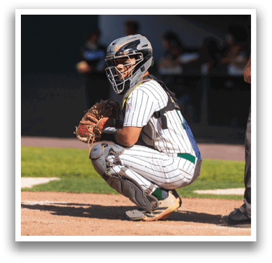 A baseball player in a striped uniform is swinging a bat. Description generated by AI