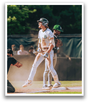 A baseball player is standing on the pitcher's mound. Description generated by AI