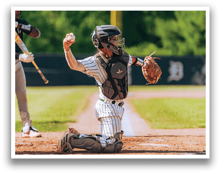 A baseball player is sliding into home plate. Description generated by AI