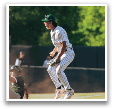 A baseball player is standing on the field. Description generated by AI