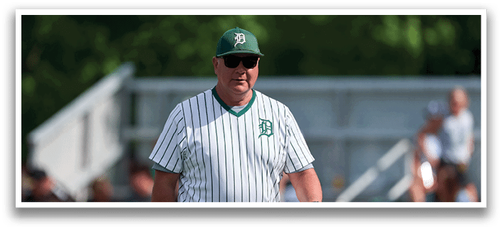 Five men wearing green jerseys with the number 11, 18, 19, 24, and 34 on them. Description generated by AI