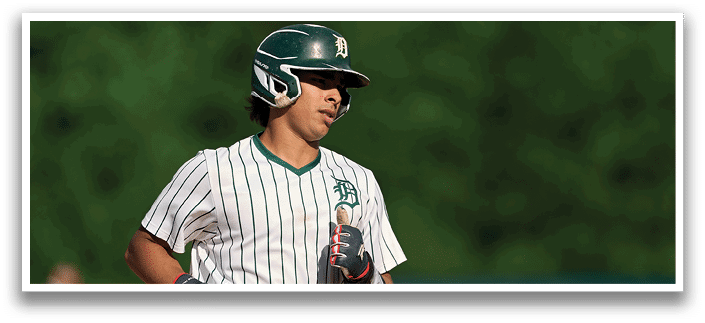 Five men wearing green jerseys with the number 11, 18, 19, 24, and 34 on them. Description generated by AI