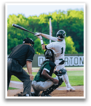 A baseball player is standing on the pitcher's mound. Description generated by AI
