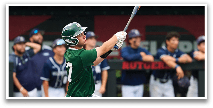 A baseball game is taking place with a man in a black shirt and gray pants standing behind a catcher. Description generated by AI