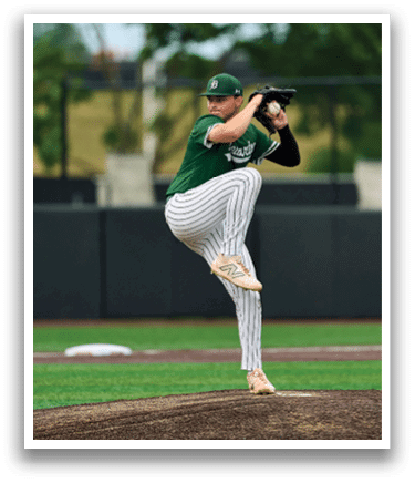 A baseball player is standing on the pitcher's mound. Description generated by AI