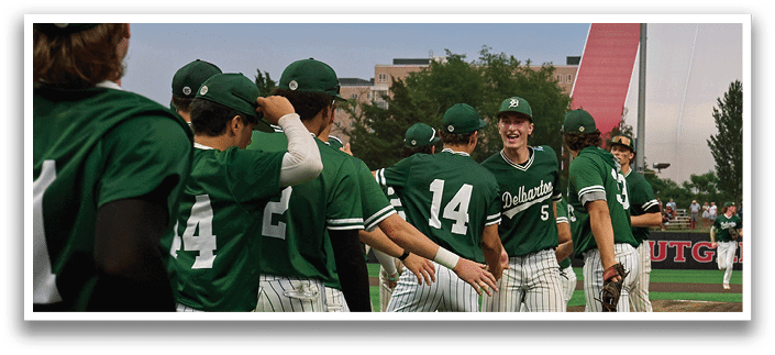Five men wearing green jerseys with the number 11, 18, 19, 24, and 34 on them. Description generated by AI