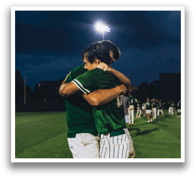 A man and woman are standing next to a football player. Description generated by AI