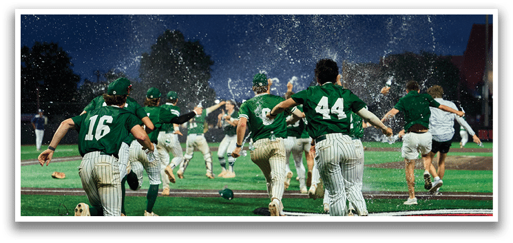 A group of young men wearing green and white uniforms. Description generated by AI