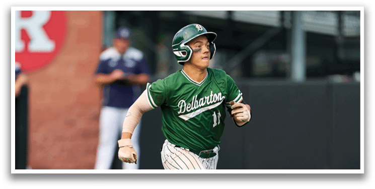 A baseball player is at bat, holding a bat and waiting for the pitch. Description generated by AI