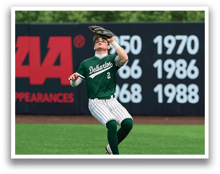 A baseball player is holding a bat and getting ready to swing. Description generated by AI