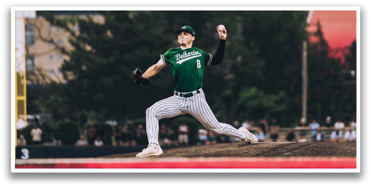 A baseball game is taking place with a man in a black shirt and gray pants standing behind a catcher. Description generated by AI