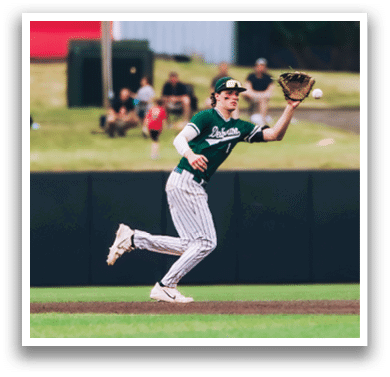 A baseball player is standing on the field. Description generated by AI