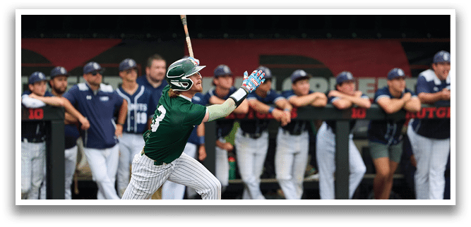 A baseball player is at bat, holding a bat and wearing a black and white uniform. Description generated by AI