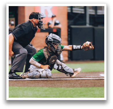 A baseball player is standing on the field. Description generated by AI