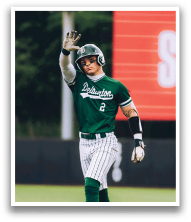 A baseball player is standing on the pitcher's mound. Description generated by AI