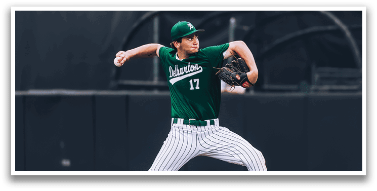A baseball game is taking place with a man in a black shirt and gray pants standing behind a catcher. Description generated by AI
