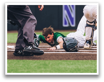 A baseball player is sliding into home plate. Description generated by AI