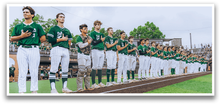 A group of people standing on a baseball field. Description generated by AI