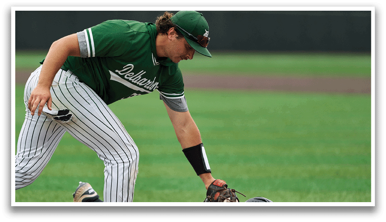 A baseball player with the number 13 on his jersey walks away from home plate. Description generated by AI