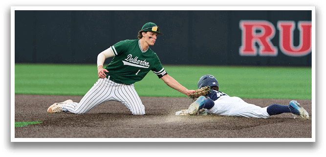 A baseball player is at bat, holding a bat and wearing a black and white uniform. Description generated by AI