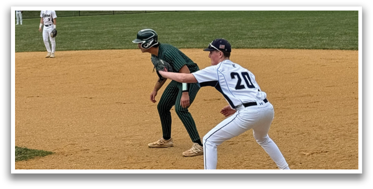 A baseball player in a white uniform is running to a base. Description generated by AI