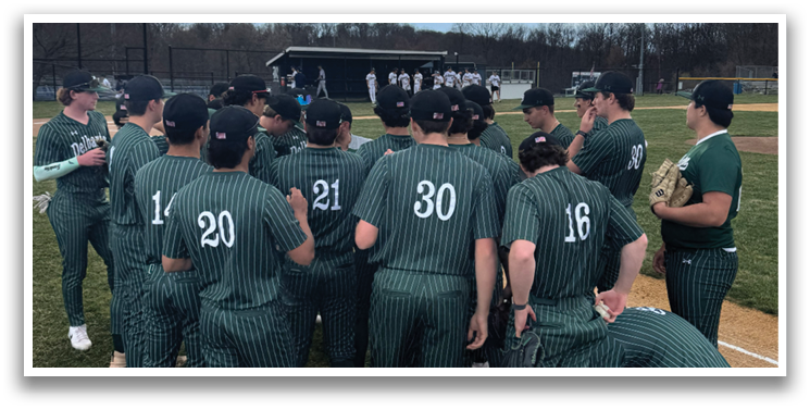 A group of baseball players wearing green shirts and black hats. Description generated by AI