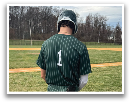 A baseball player wearing a green and white uniform with the number 1 on the back. Description generated by AI