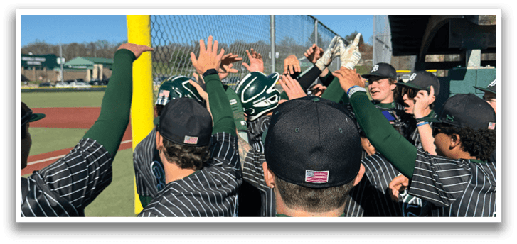 A group of baseball players standing on a field. Description generated by AI