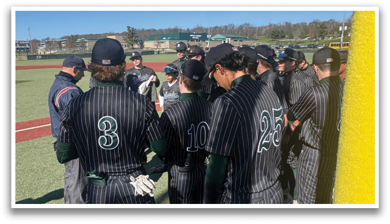 A group of baseball players wearing black and green uniforms. Description generated by AI