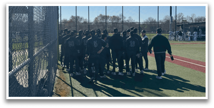 A group of baseball players standing on a field. Description generated by AI