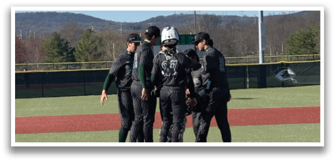 A group of people standing on a baseball field. Description generated by AI