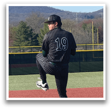 A baseball player is standing on the pitcher's mound. Description generated by AI