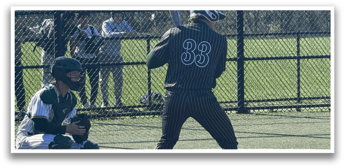 A baseball player is at bat, wearing a number 33 jersey. Description generated by AI
