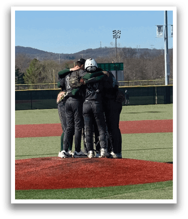 A group of baseball players hugging each other on a field. Description generated by AI