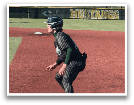 A baseball player is running to a base. Description generated by AI