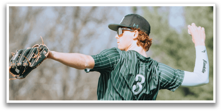 A baseball player wearing a green and white uniform. Description generated by AI