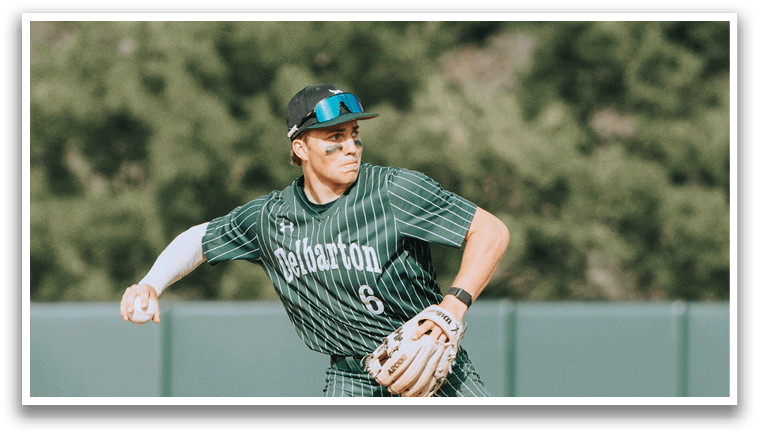 A baseball player wearing a green and white uniform. Description generated by AI