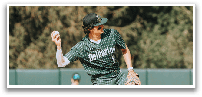 A baseball player wearing a green and white striped uniform is throwing a ball. Description generated by AI
