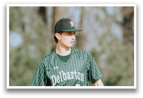 A baseball player wearing a green and black uniform. Description generated by AI
