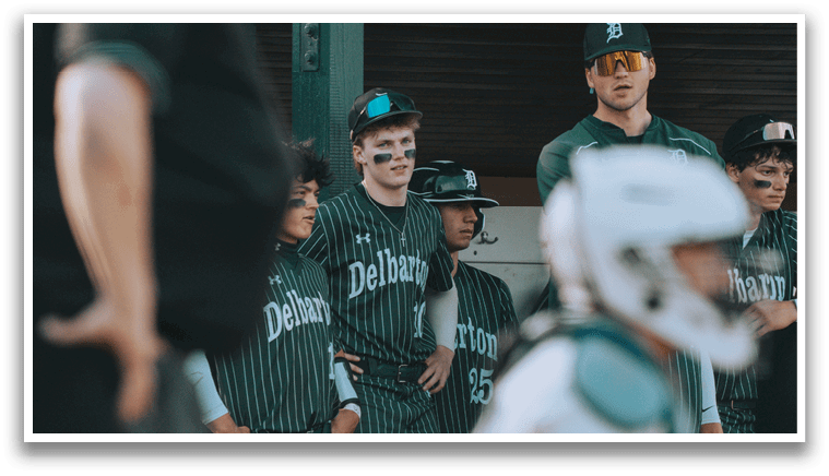 A group of baseball players wearing striped uniforms. Description generated by AI