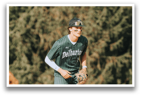 A baseball player wearing a green and white striped uniform. Description generated by AI