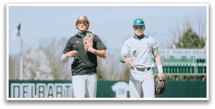 Two baseball players walking on a field. Description generated by AI