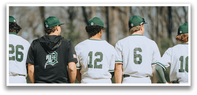A group of baseball players standing on the field. Description generated by AI