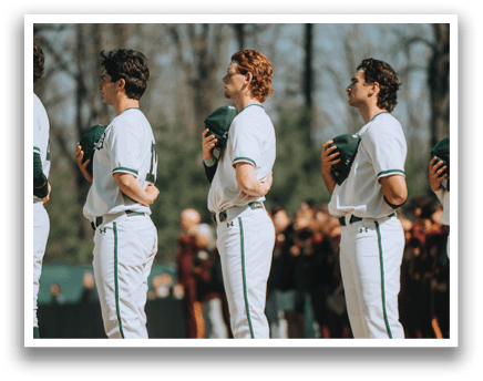 A group of people standing on a field. Description generated by AI